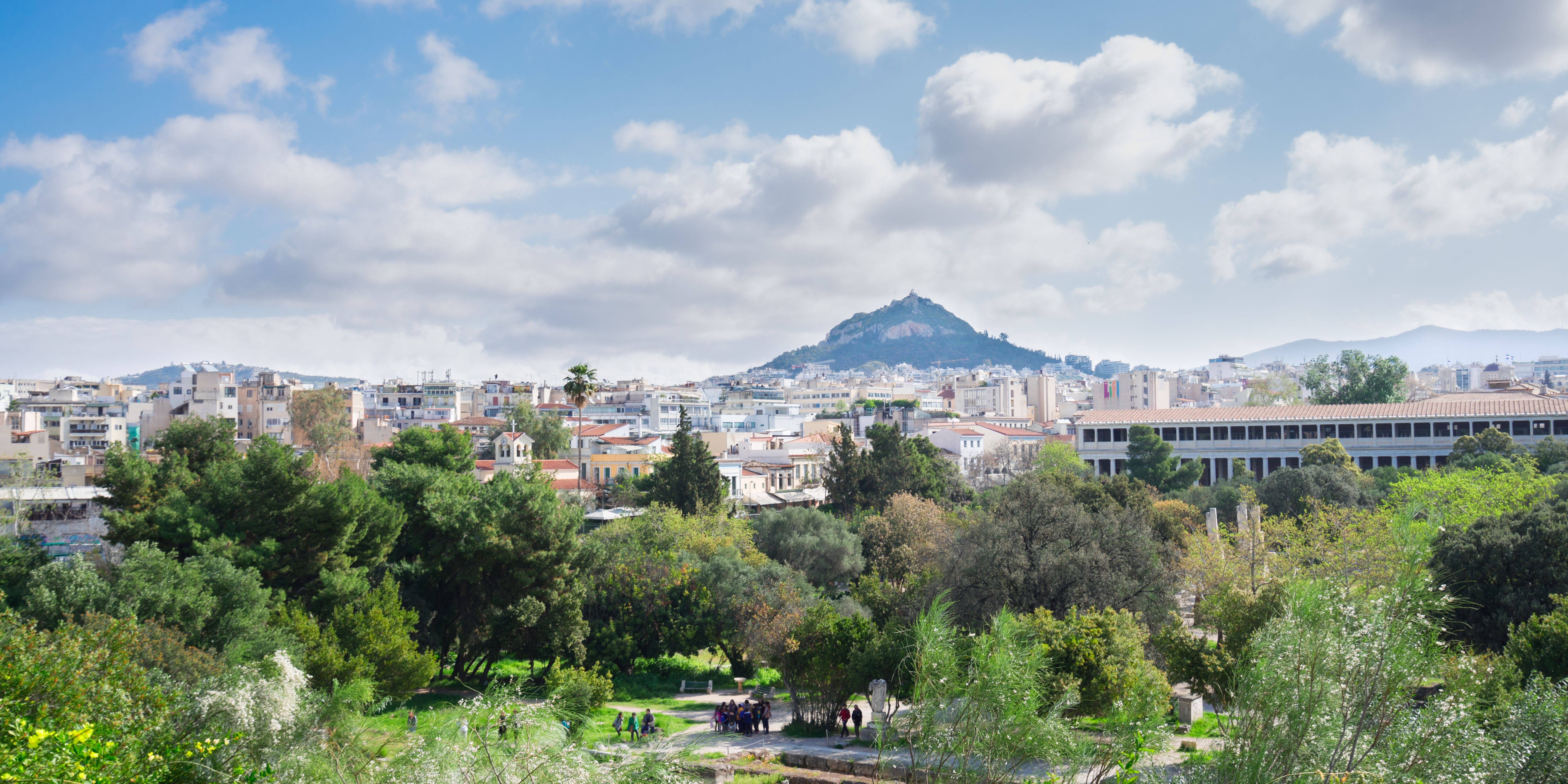 View of Lycabettus Hill overlooking the cityscape and greenery in Athens.